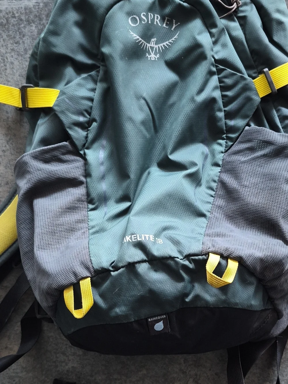OSPREY Teal Backpack with Yellow Accents and Gray Pockets